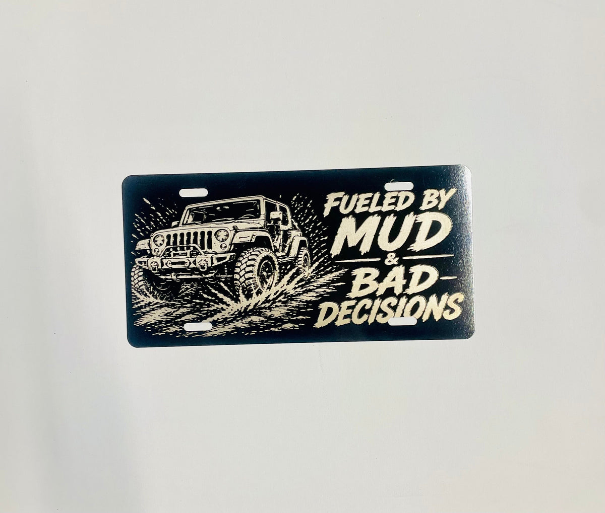 Gloss Black Aluminum Car Tag Laser Engraved "Fueled By Mud & Bad Decisions"